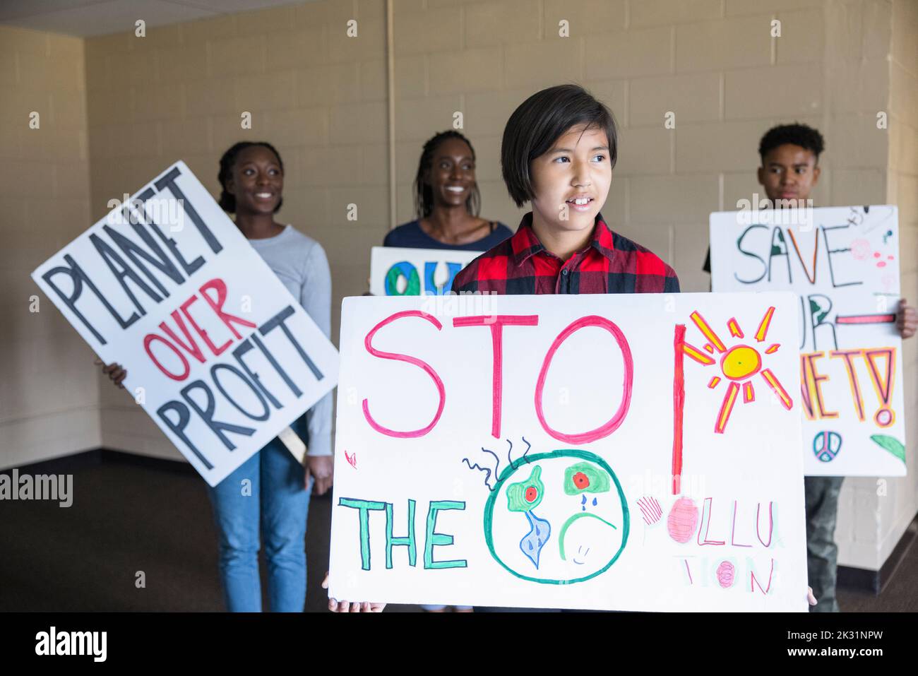 Confident teen environmental activists with posters Stock Photo