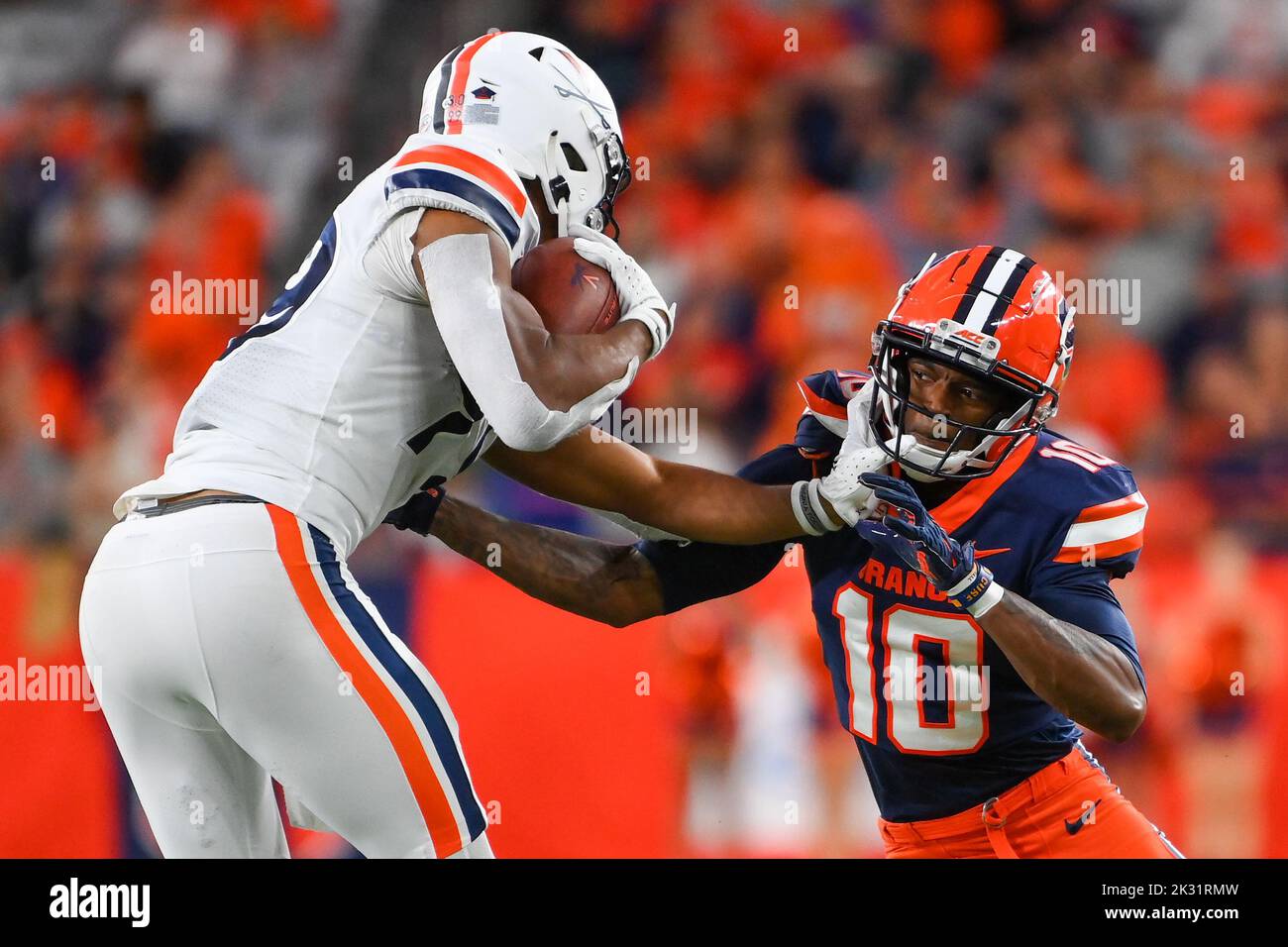 September 23, 2022: Virginia Cavaliers wide receiver Keytaon Thompson (99) stiff-arms Syracuse Orange defensive back Alijah Clark (10) while running with the ball during the second half on Friday, Sep., 23, 2022 at the JMA Wireless Dome in Syracuse, New York. Rich Barnes/CSM Stock Photo