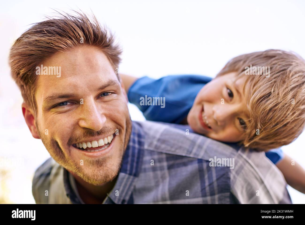Like two peas in a pod. Portrait of an affectionate young father and his son. Stock Photo