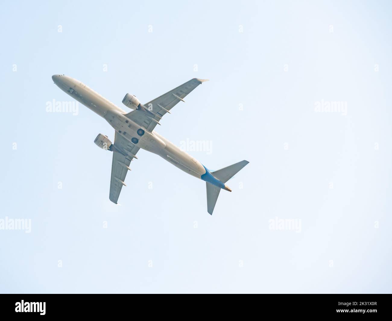 An airplane that flies in the sky Stock Photo - Alamy