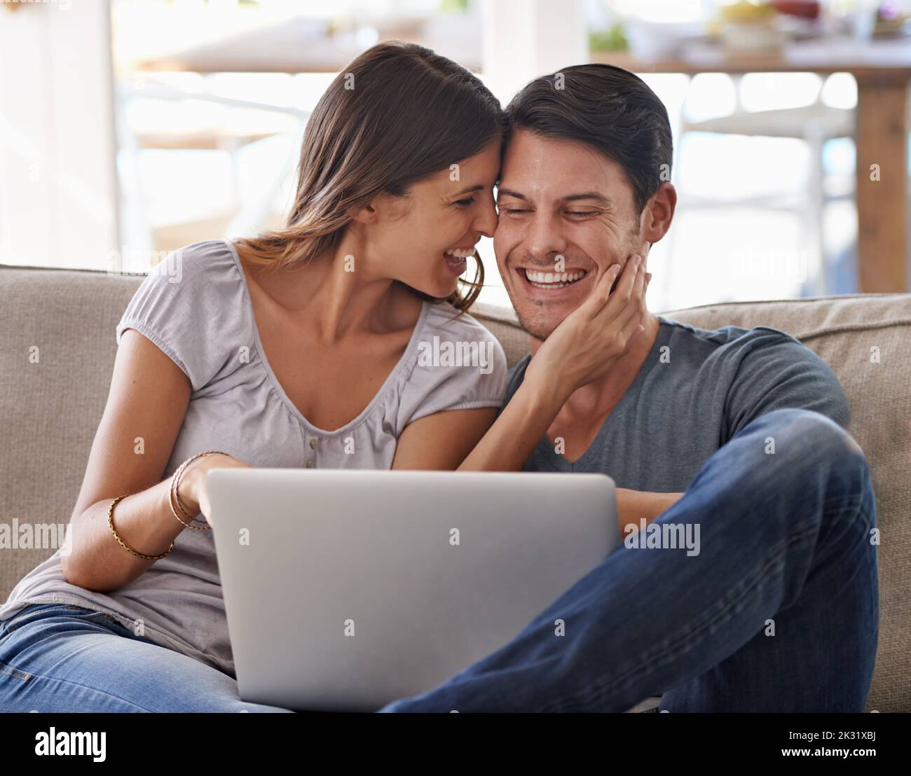 Caught in the web of her love. an affectionate young couple spending quality time together. Stock Photo