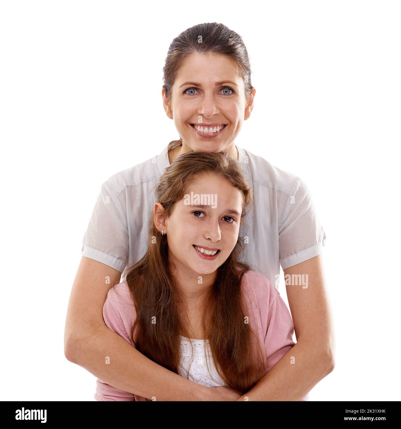 Im lucky to have such a beautiful daughter. Portrait of a mother embracing her daughter from behind. Stock Photo