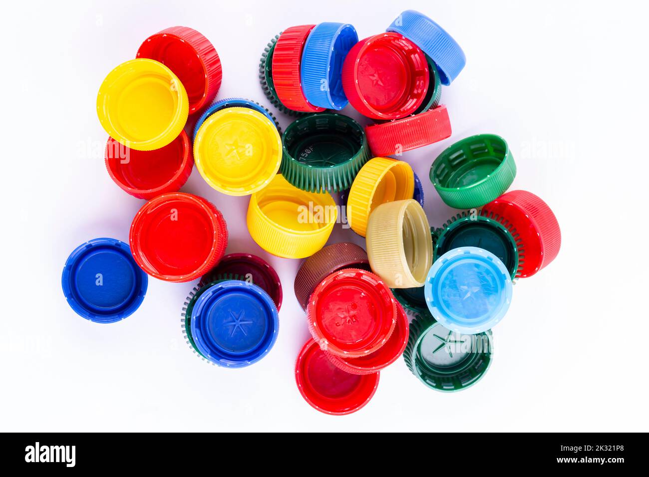 Plastic bottle caps on white background. Cap material is recyclable