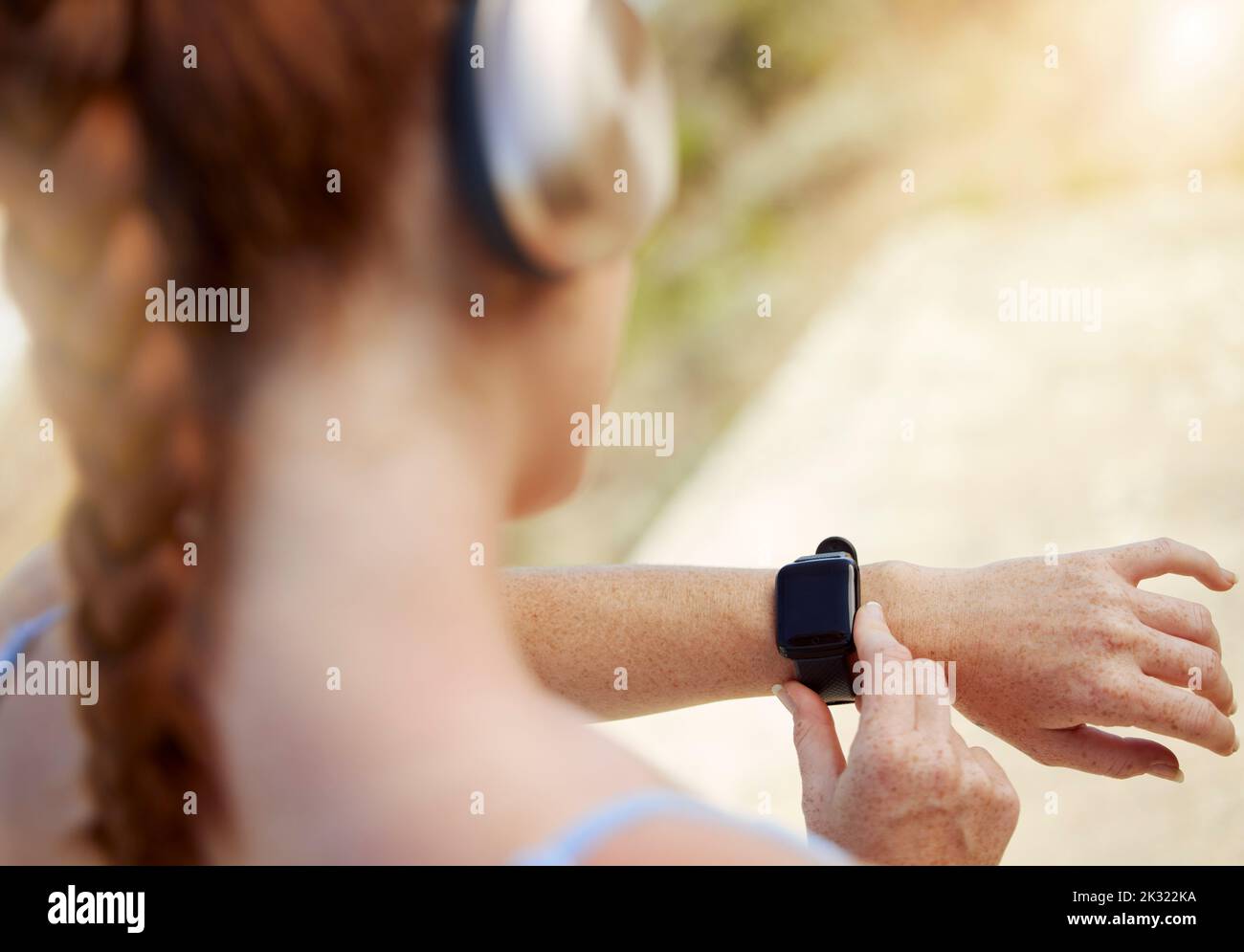 Fitness woman, smartwatch and sports woman outside tracking progress for exercise, cardio training and outdoor workout for health. Closeup active Stock Photo