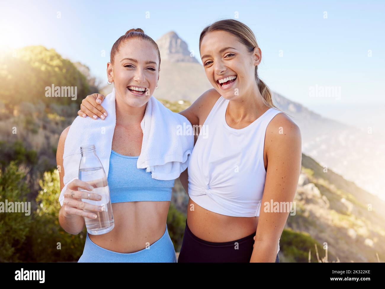 Fitness friends, happy women and exercise with water bottle while out hiking, running and training for health, happiness and wellness. Female portrait Stock Photo