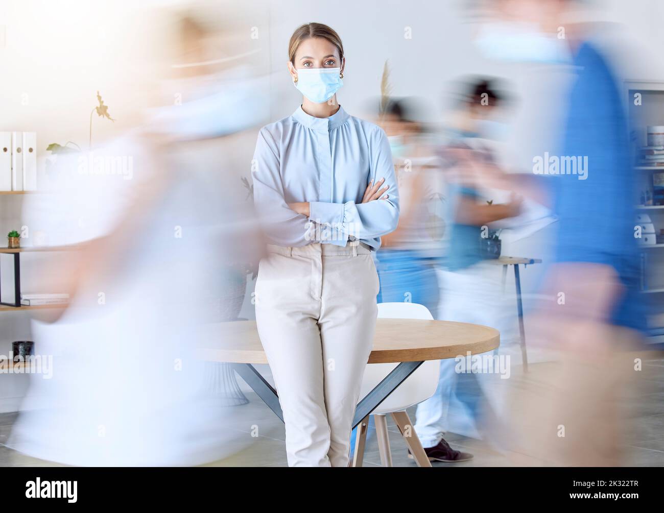 Covid, busy office and business woman portrait with face mask rules for staff safety, healthcare and corona virus risk in modern office. Motion blur Stock Photo