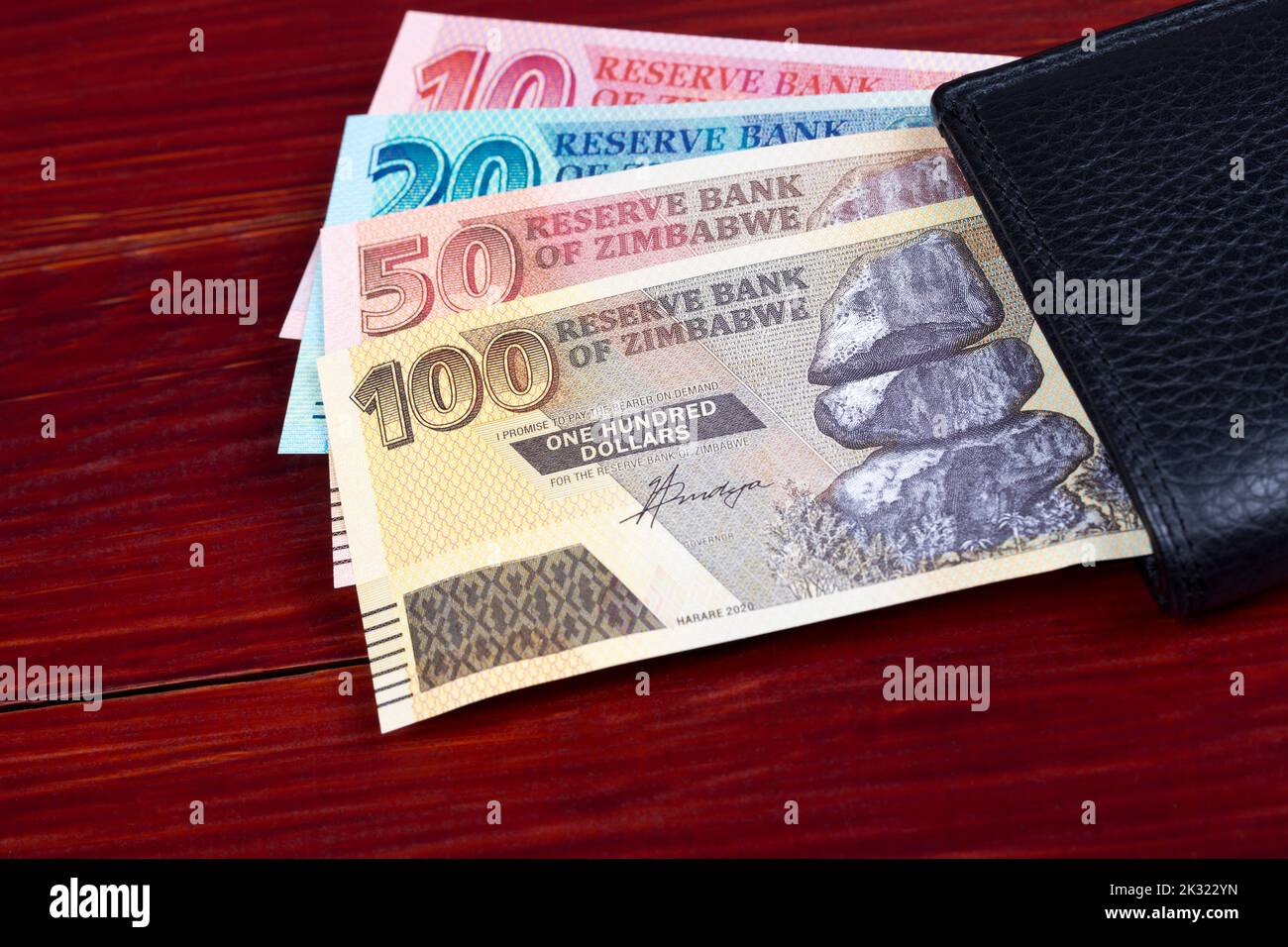 Zimbabwean money - Dollars  in the black wallet Stock Photo