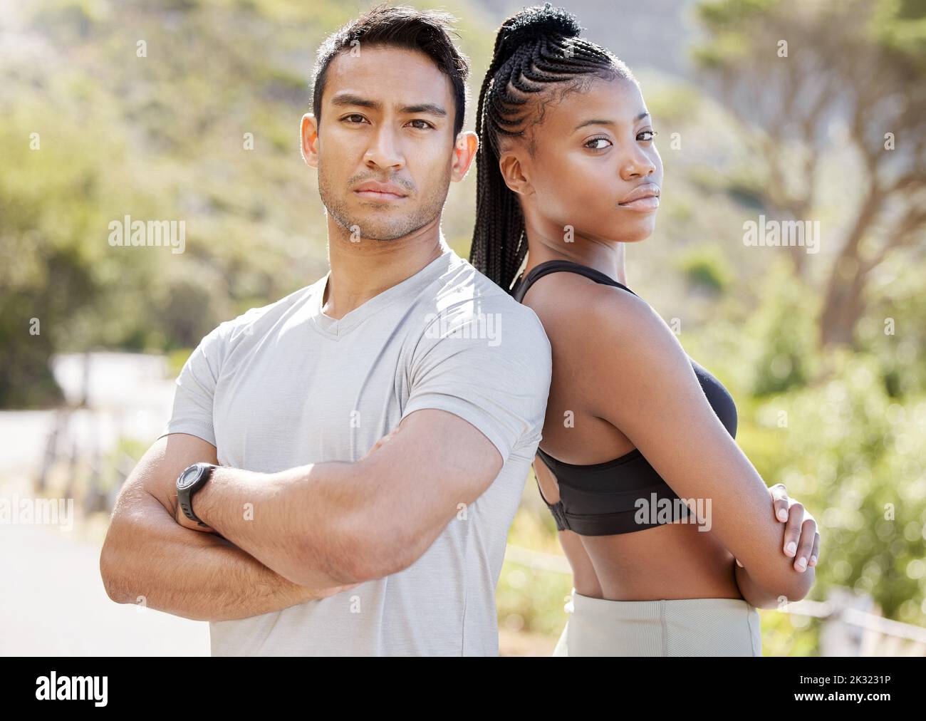 Fitness, motivation and couple standing in power, ready to challenge endurance with a cool, proud attitude. Health, training and mean personal trainer Stock Photo