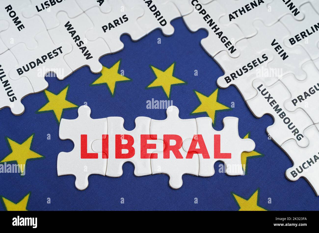 European Union concept. The EU flag has city name puzzles and puzzles with the words - Liberal Stock Photo