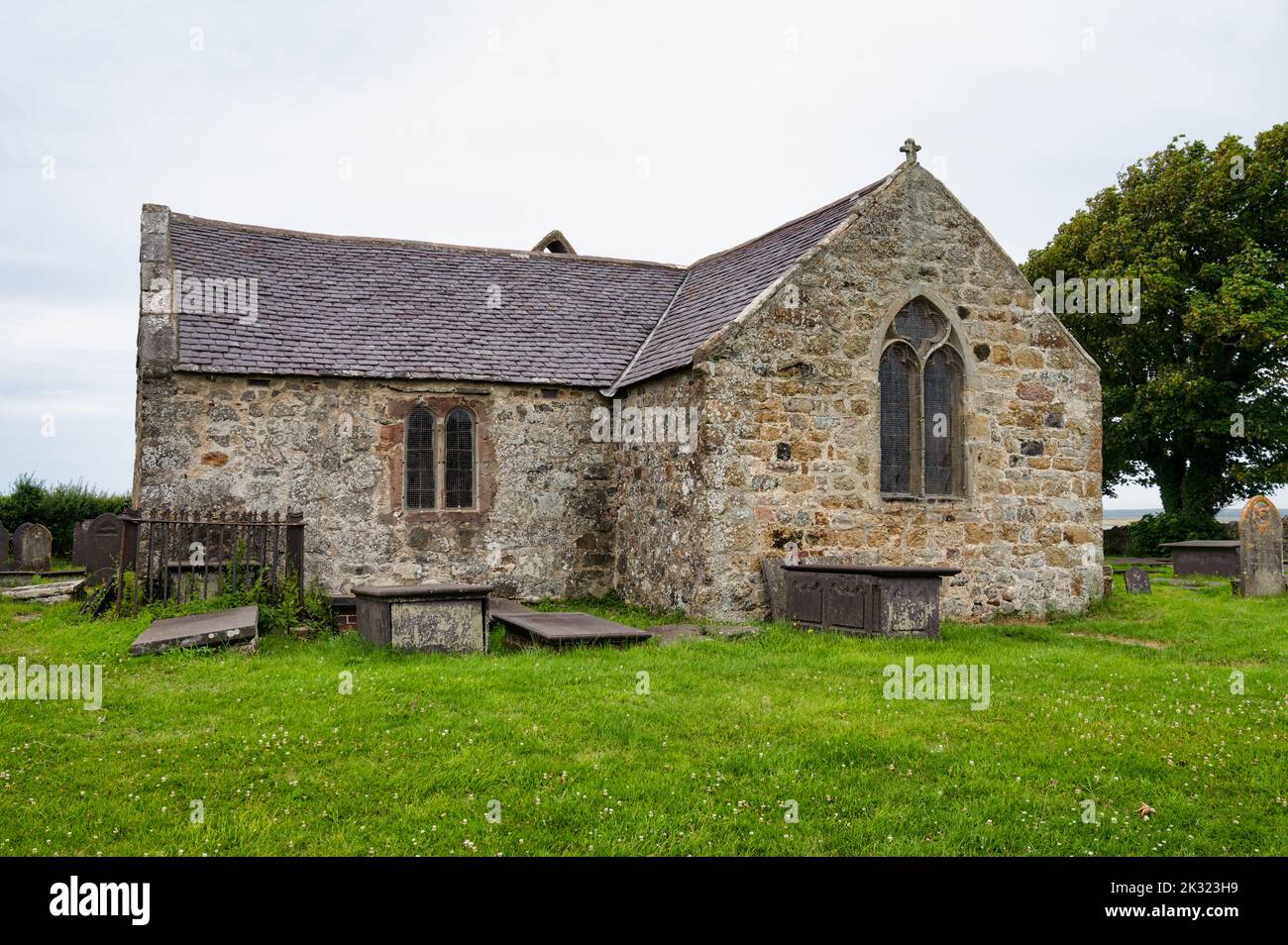 Gwynedd, UK- July 12, 2022: St Baglan's church and cemetery located on the north Wales coast. Stock Photo