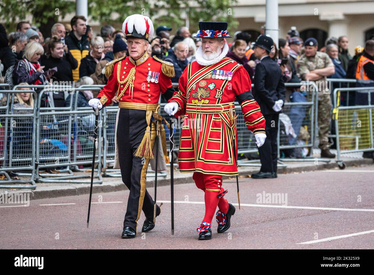 A Yeoman Warder walks on the road at the Queen Elizabeth II funeral procession in London following the Queen's death, England, United Kingdom Stock Photo