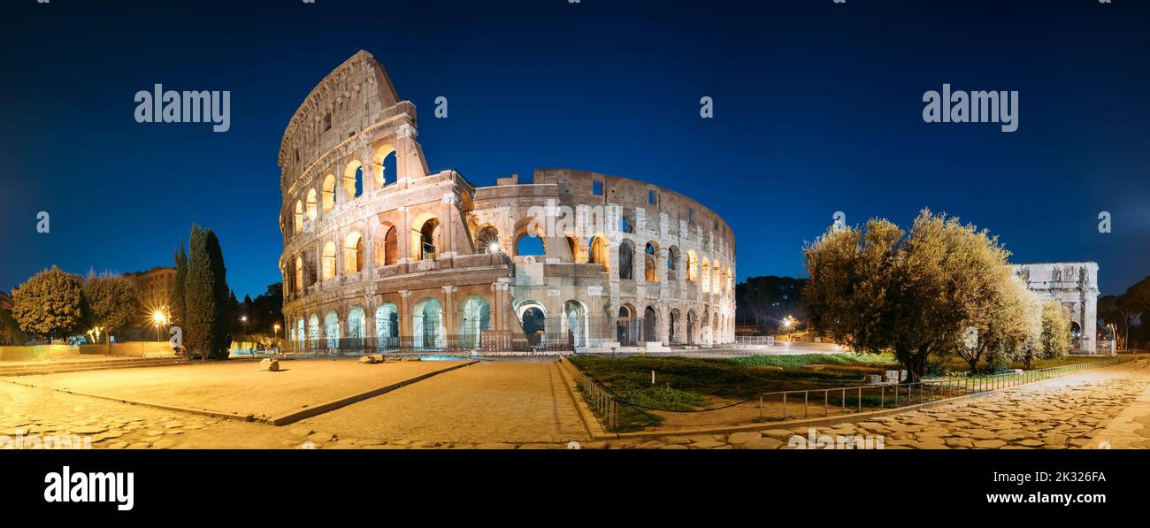 Rome, Italy. Colosseum Also Known As Flavian Amphitheatre In Evening Or Night Time. Stock Photo