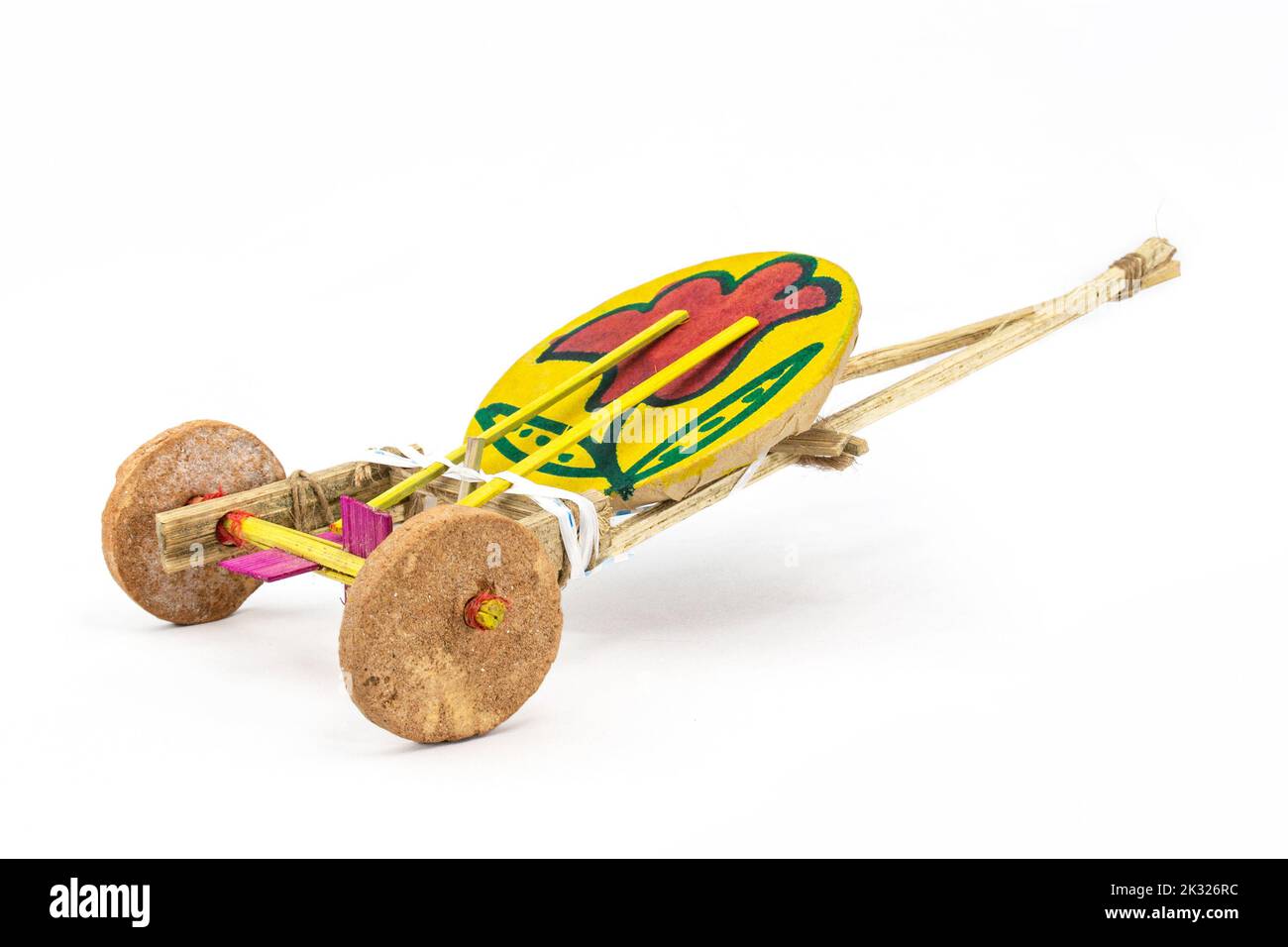 Tomtom gari. traditional handmade new year carnival wagon toy of Boishakhi mela in Bangladesh. made of clay wheel drum and bamboo stick tighten with s Stock Photo