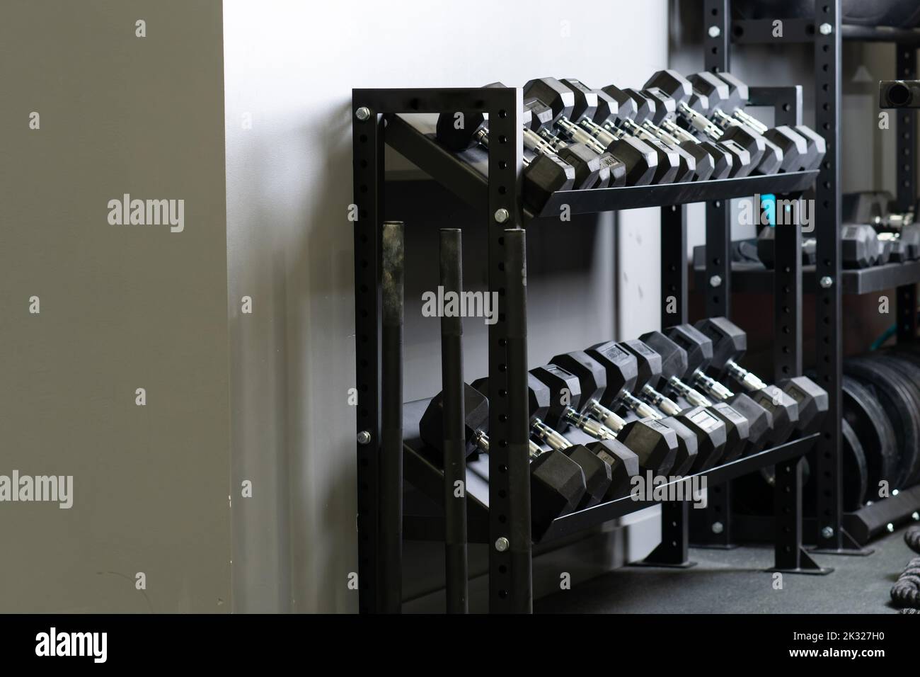 Dumbbell wall home gym blurry set storage strongman sport, for accessories gear for black from bodybuilder active, fit bodybuilding. Lifting , Stock Photo