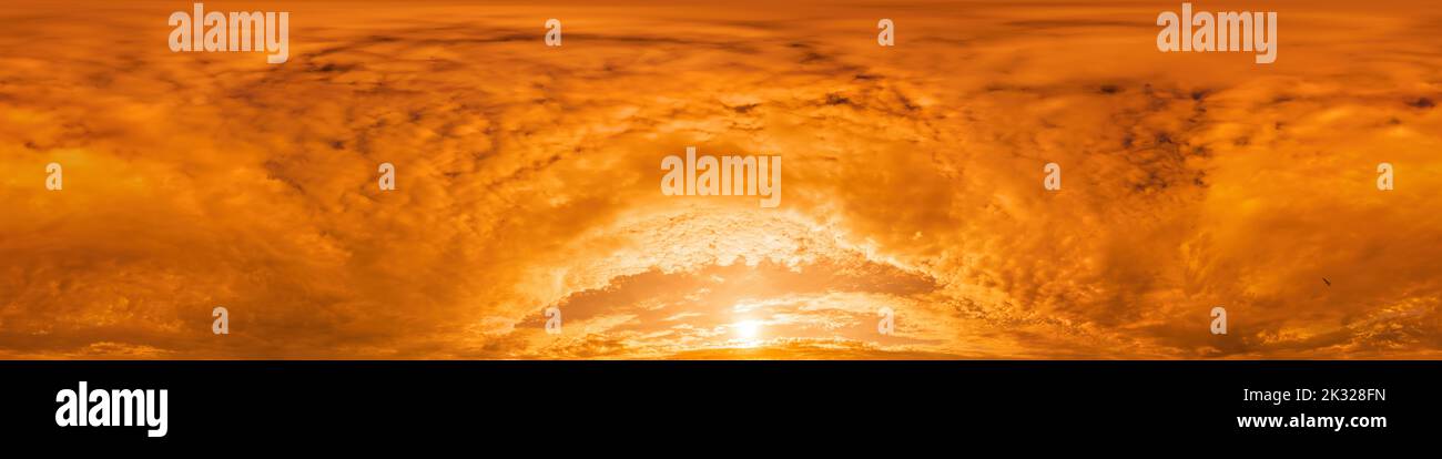 Golden glowing red orange overcast sunset sky panorama. Hdr seamless spherical equirectangular 360 panorama. Sky dome or zenith for 3D visualization Stock Photo