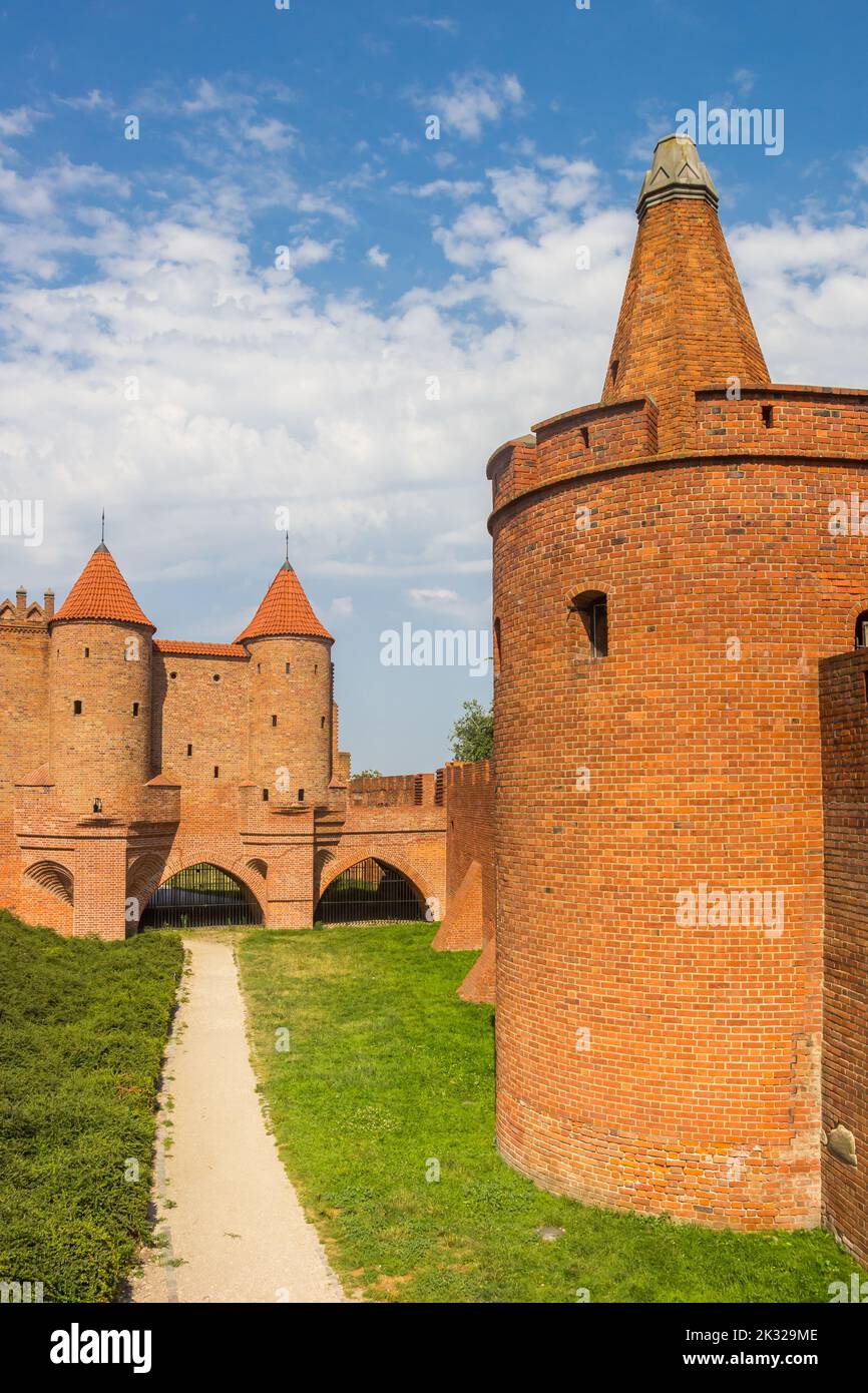 Historic red brick city gate in the center of Warsaw, Poland Stock Photo