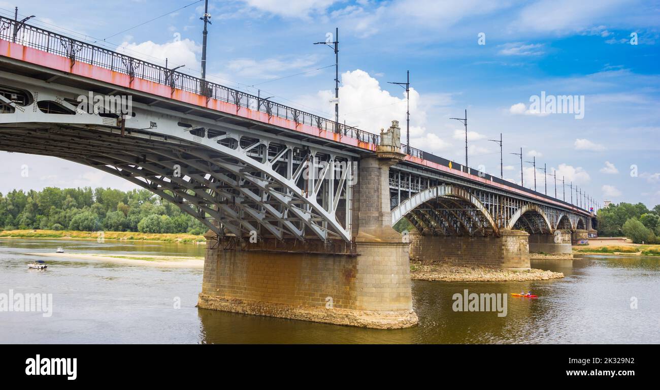 Historic Slasko-Dabrowski Bridge over the Wisla river in Warsaw, Poland Stock Photo
