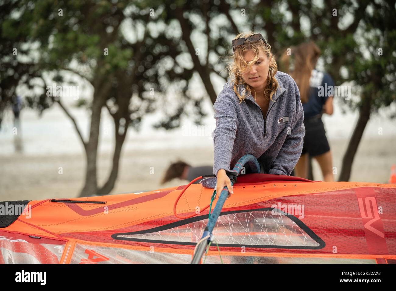 A young female competitor sets up her equipment to compete the New