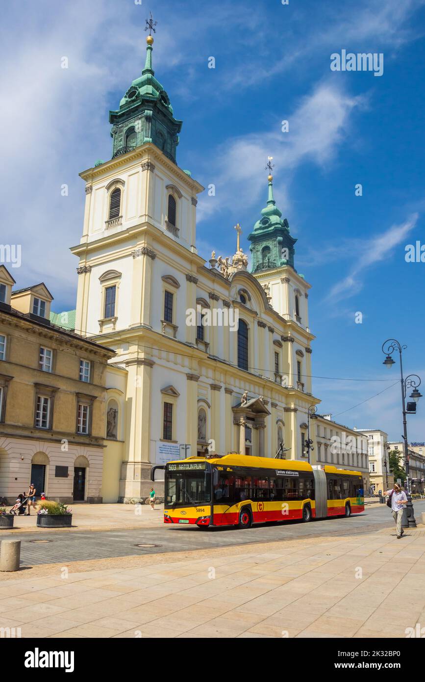 Bus in front of the holy cross church in Warsaw, Poland Stock Photo