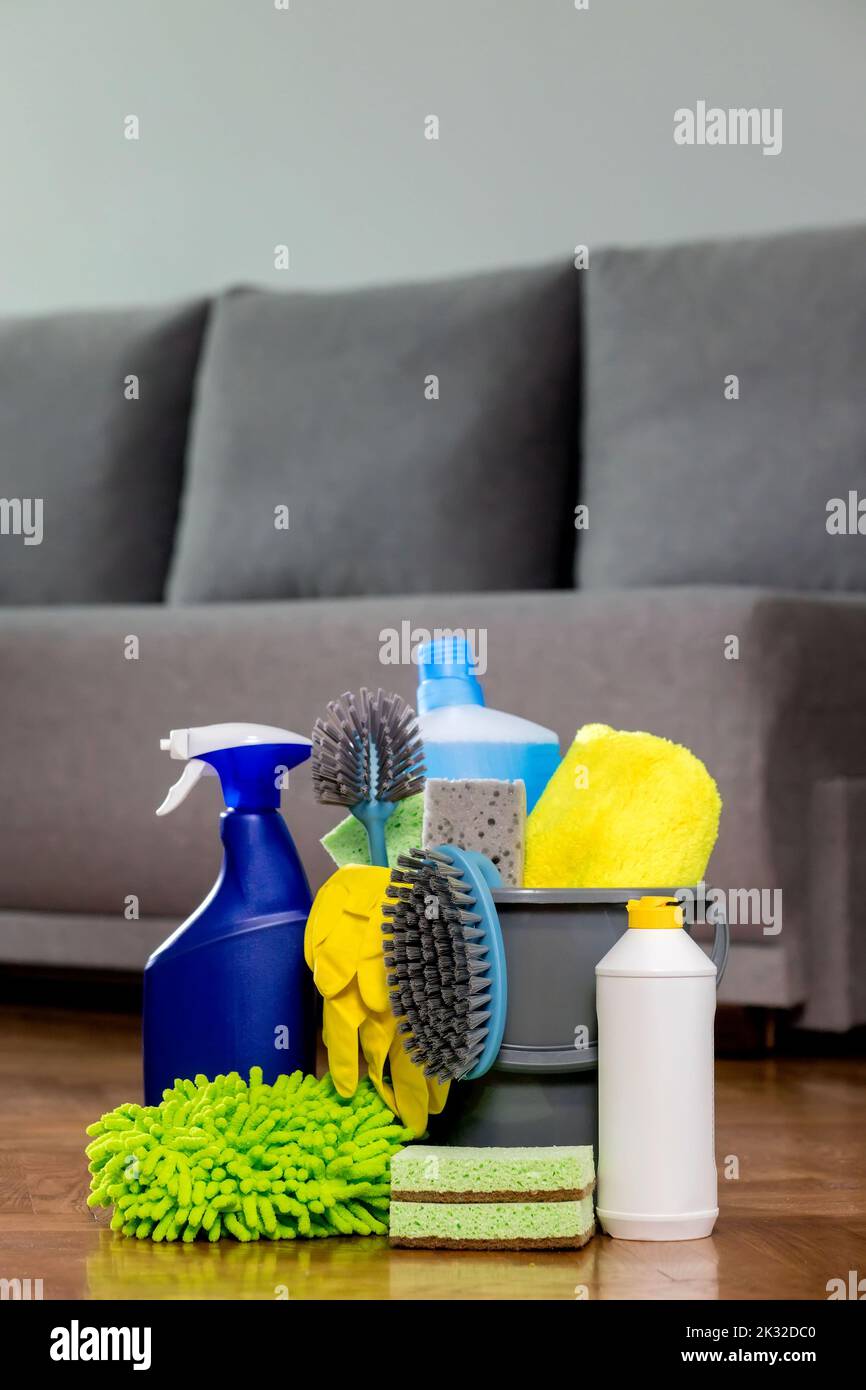 Bucket with cleaning items in the house, standing on the floor, on the