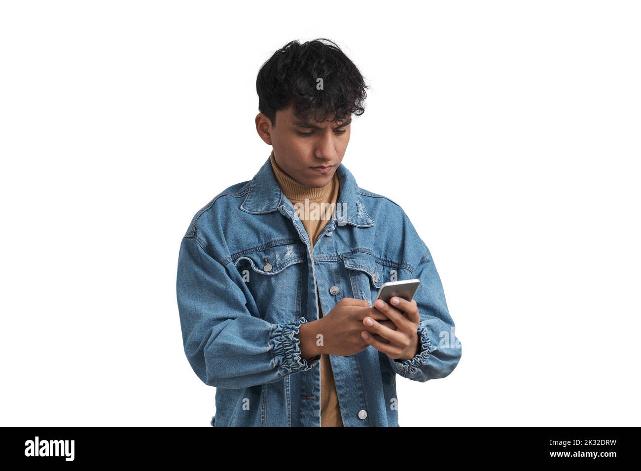 Young peruvian man using smartphone, isolated. Stock Photo