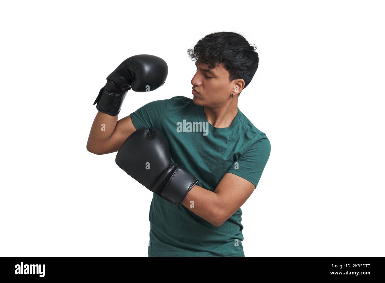 Young peruvian boxer doing strong pose, isolated. Stock Photo