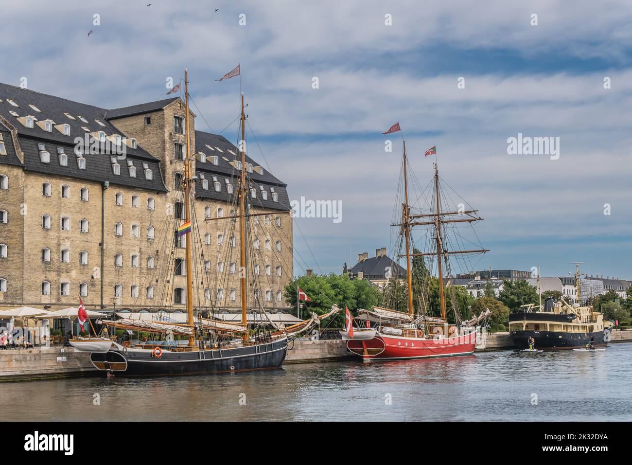 Old warehouses at the seafront in Copenhagen, Denmark Stock Photo