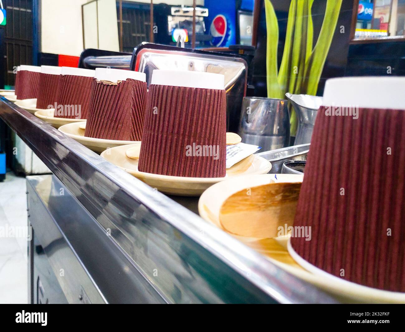 December 8th 2020. Uttarakhand India. Organic disposable paper cups and plates on counter top in a restaurant. Stock Photo