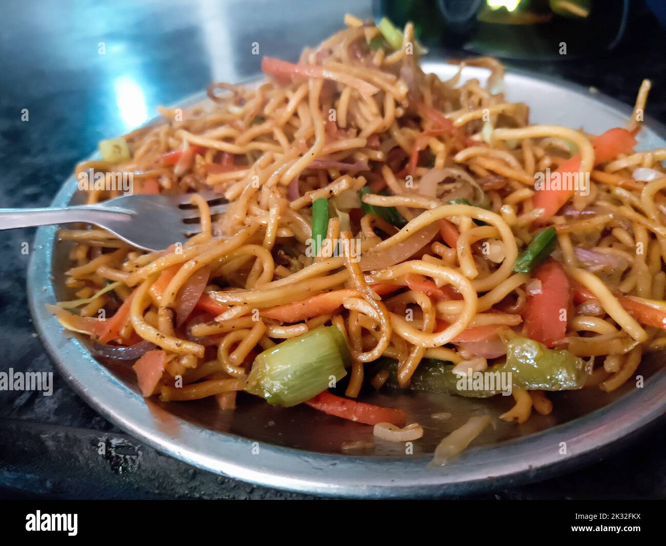 A close up shot of mix vegetable noodles or Chowmein in a road side