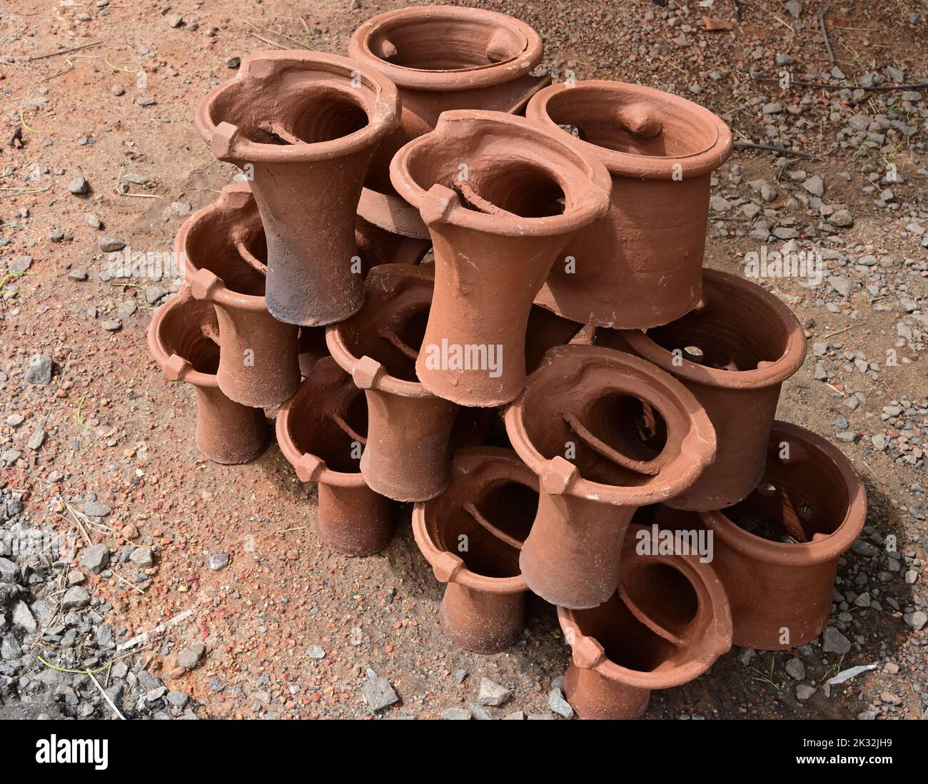 Double clay stoves piled on top of each other near a main road to sell
