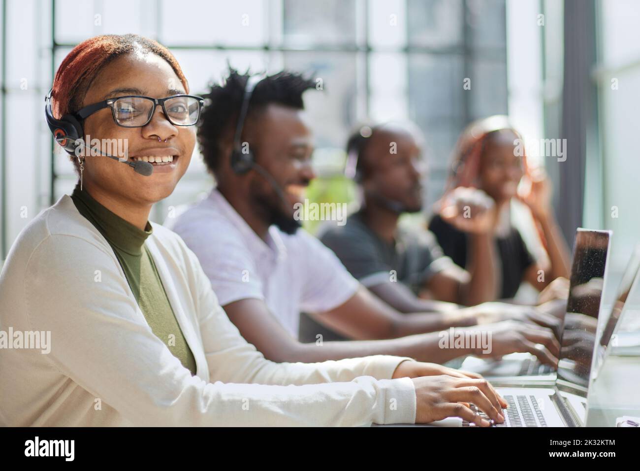 Beautiful african woman working hi-res stock photography and images - Alamy