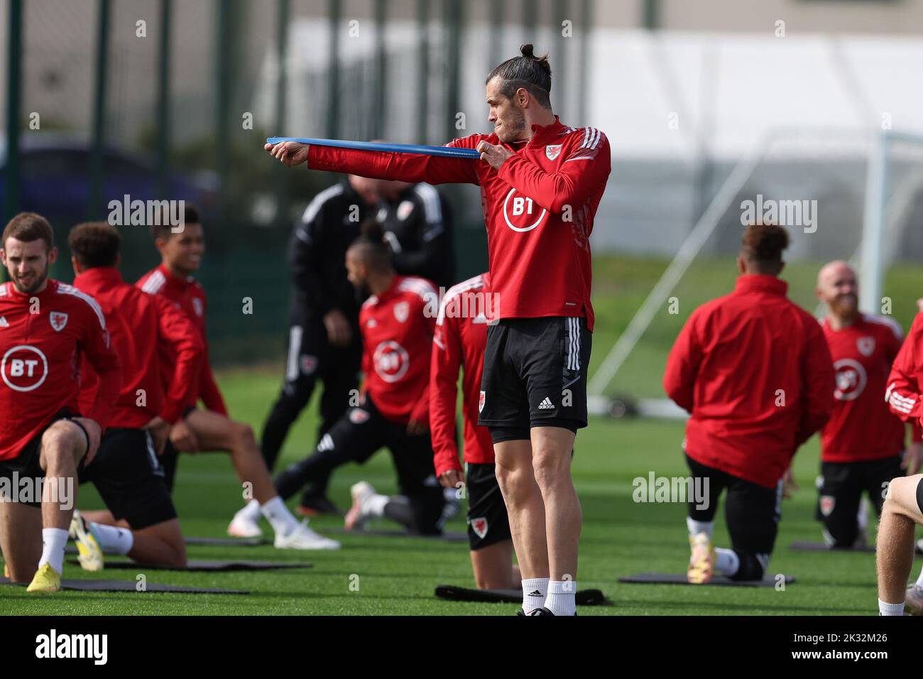 Cardiff, UK. 24th Sep, 2022. Gareth Bale of Wales jokes around pretending to do archery during the Wales football team MD1 training session at the Vale Resort, Hensol, near Cardiff on Saturday 24th September 2022. The team are preparing for their next match, a UEFA Nations league match against Poland tomorrow . this image may only be used for Editorial purposes. Editorial use only, pic by Andrew Orchard/Andrew Orchard sports photography/Alamy Live news Credit: Andrew Orchard sports photography/Alamy Live News Stock Photo