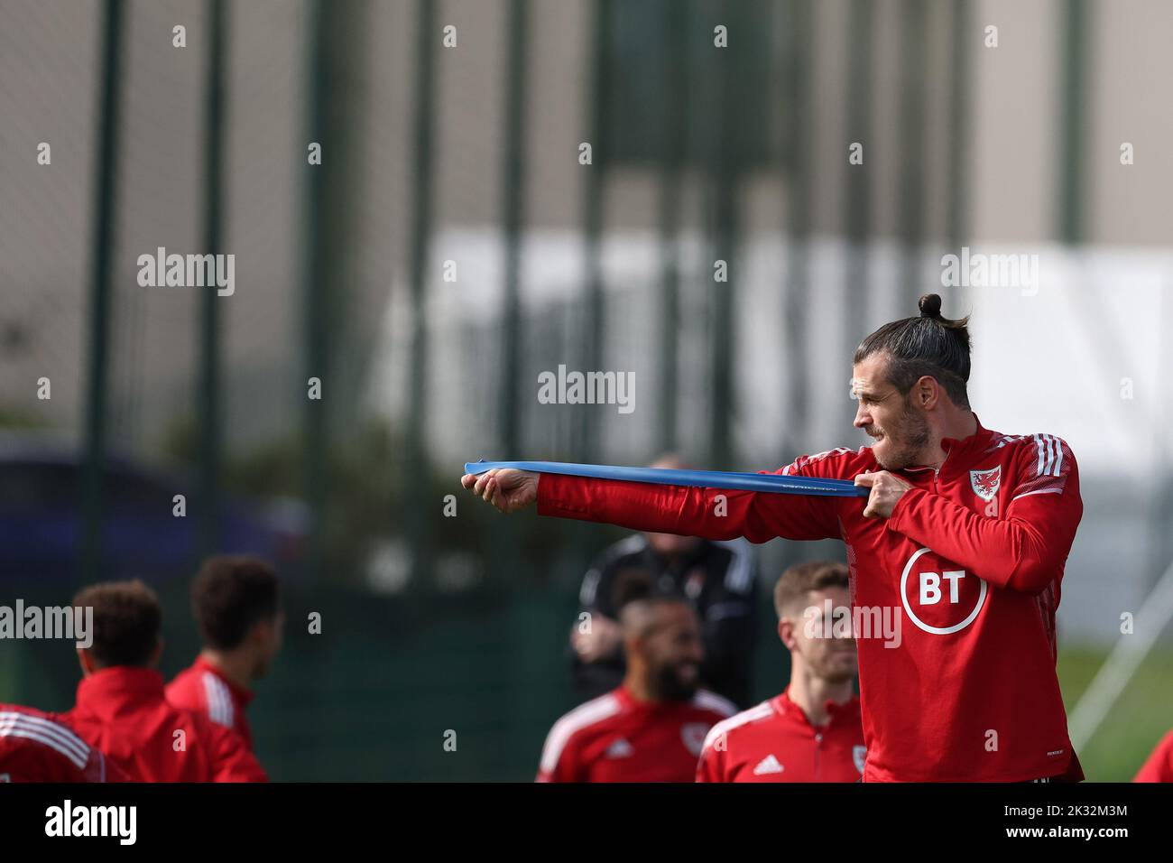 Cardiff, UK. 24th Sep, 2022. Gareth Bale of Wales jokes around pretending to do archery during the Wales football team MD1 training session at the Vale Resort, Hensol, near Cardiff on Saturday 24th September 2022. The team are preparing for their next match, a UEFA Nations league match against Poland tomorrow . this image may only be used for Editorial purposes. Editorial use only, pic by Andrew Orchard/Andrew Orchard sports photography/Alamy Live news Credit: Andrew Orchard sports photography/Alamy Live News Stock Photo