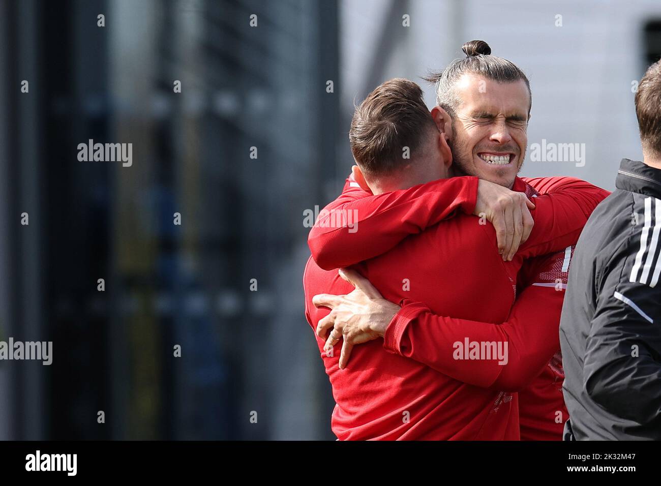 Cardiff, UK. 24th Sep, 2022. Gareth Bale of Wales (r) hugs Connor Roberts of Wales during the Wales football team MD1 training session at the Vale Resort, Hensol, near Cardiff on Saturday 24th September 2022. The team are preparing for their next match, a UEFA Nations league match against Poland tomorrow . this image may only be used for Editorial purposes. Editorial use only, pic by Andrew Orchard/Andrew Orchard sports photography/Alamy Live news Credit: Andrew Orchard sports photography/Alamy Live News Stock Photo