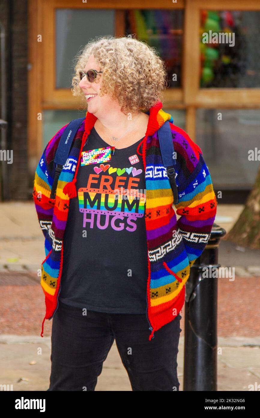 ' Free Mum Hugs' Wolly jumper in Preston, Lancashire. UK Entertainment. 24 Sept, 2022. Rainbow colours and togetherness as colourful characters gather in the Flag Market for the 8th annual city Gay Pride Festival. LGBT , gender, lesbian pride, sexual rights event, orientation, party banner, homosexuality, demonstration, tolerance, human, street carnival, lifestyle, bisexual love, homosexual parade, festival rainbow, celebration flag, transsexual equality, transgender, trans community people assemble as the celebrations begin in the city centre: MediaWorldImages/Alamy Live News Stock Photo