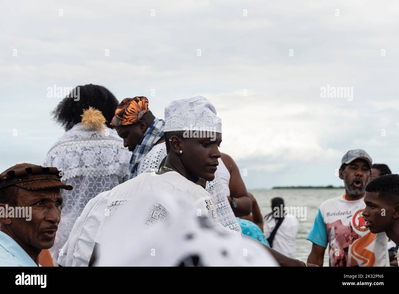 The Candomble members during a celebration in the waters of Santo Amaro ...