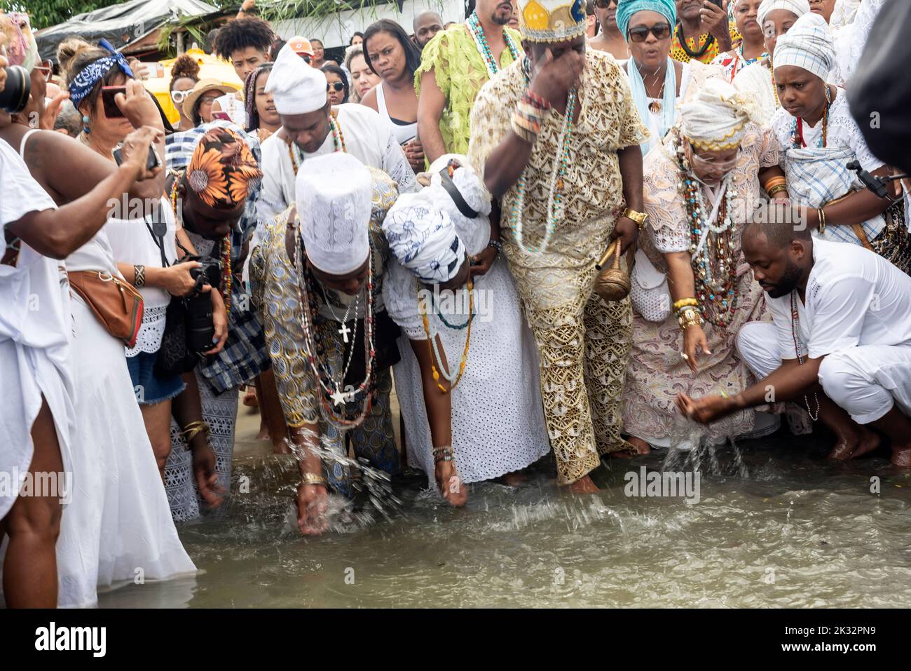 The Candomble members during a celebration in the waters of Santo Amaro ...