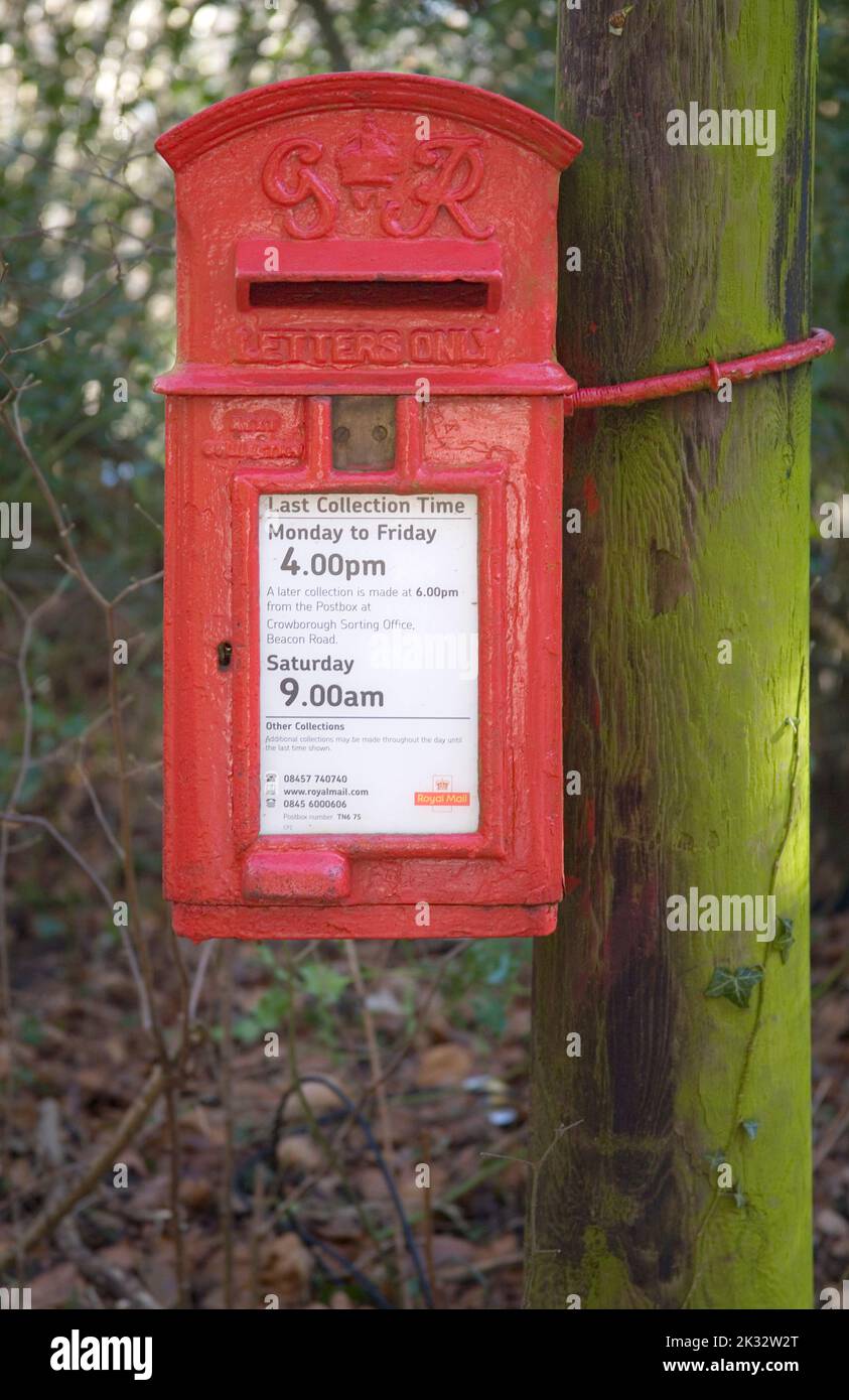 a small red post box in ashdown forest east sussex Stock Photo