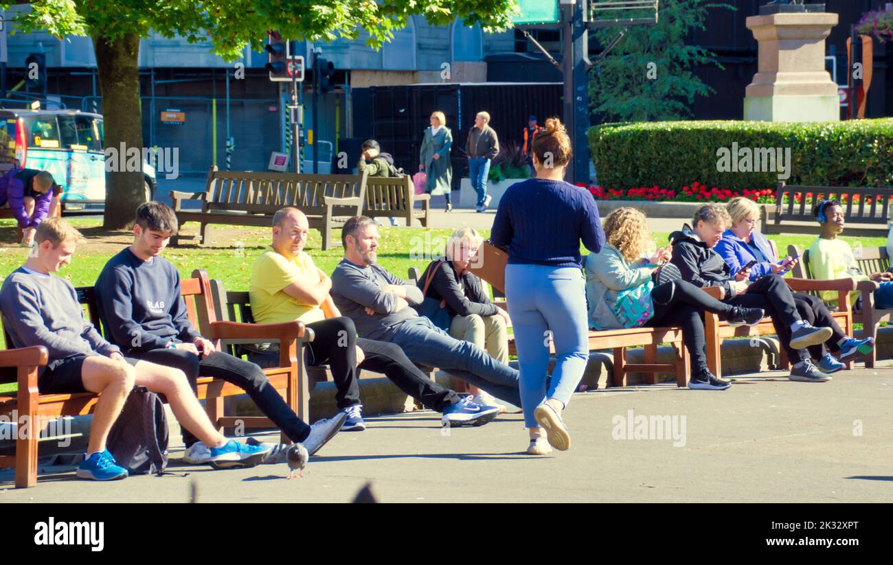 Glasgow, Scotland, UK 24th September,  2022. UK Weather: Hot and Sunny in the city saw locals an tourists take to the streets.. George square with its open air pub has become the focal point for both locals and tourists in the city. Credit Gerard Ferry/Alamy Live News Stock Photo