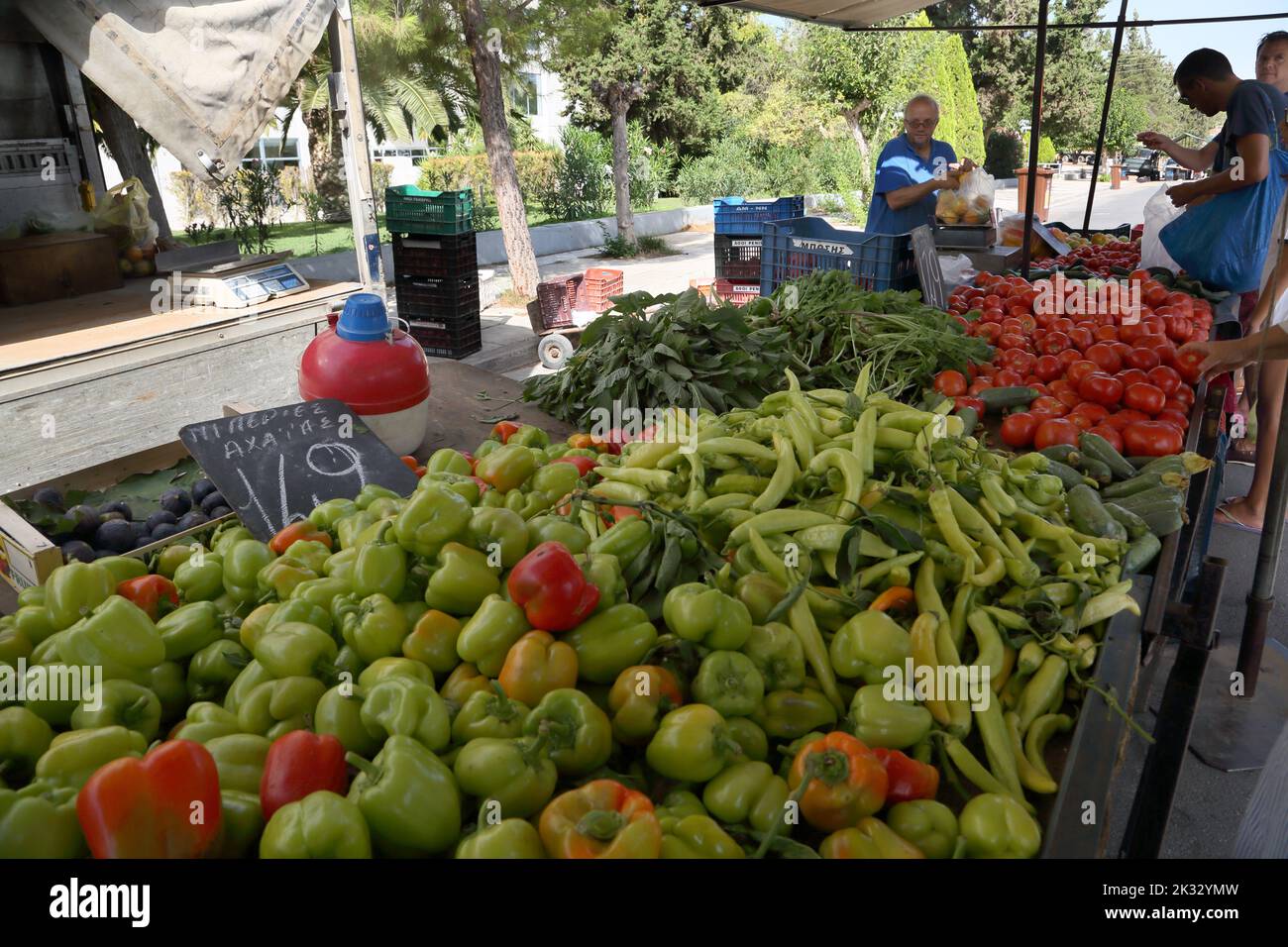 People Shopping at Saturday Market Buying Peppers and Tomatoes Vouliagmeni Athens Greece Stock Photo