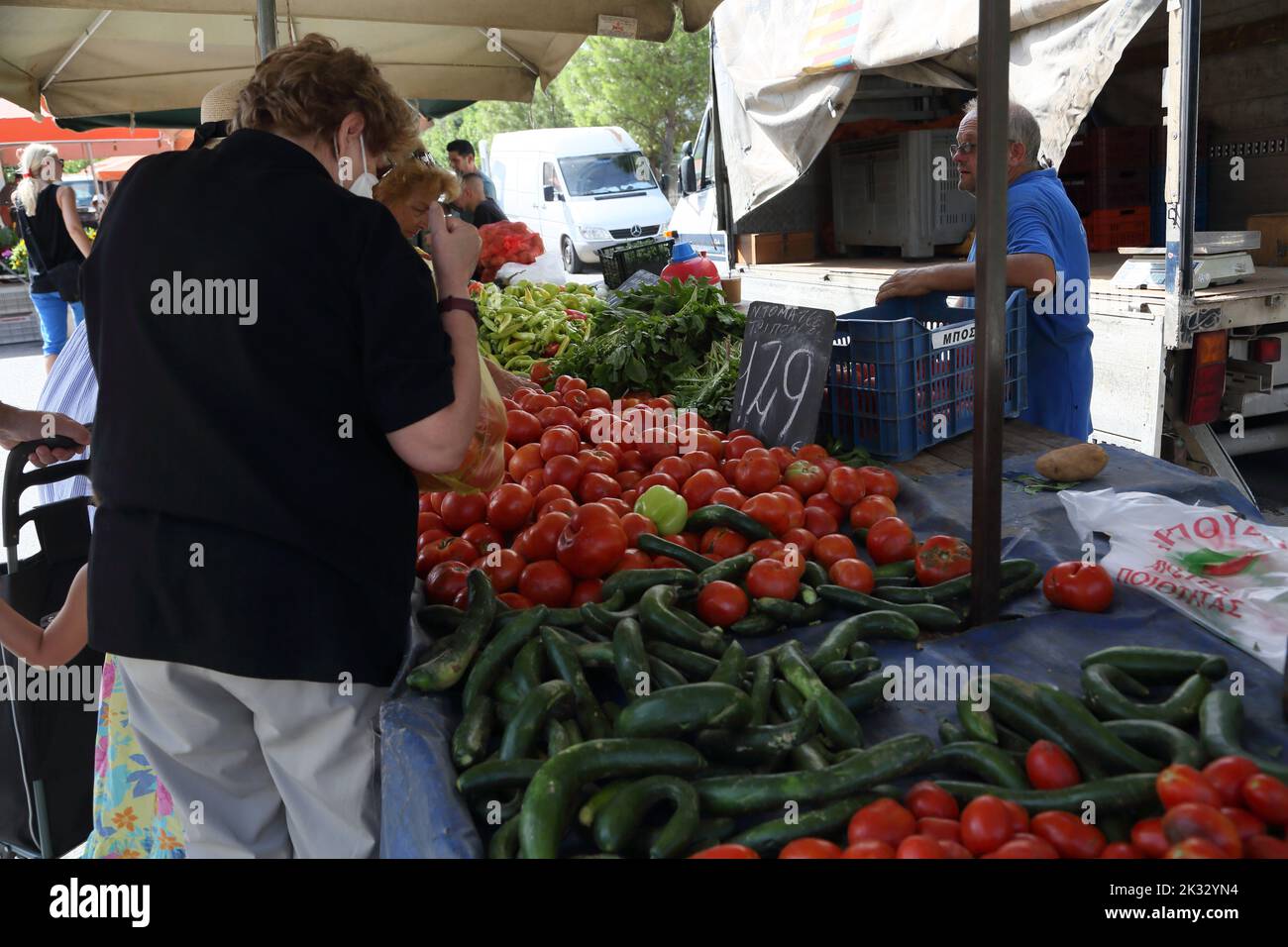 People Shopping at Saturday Market for Fruit And Vegetables Vouliagmeni Athens Greece Stock Photo