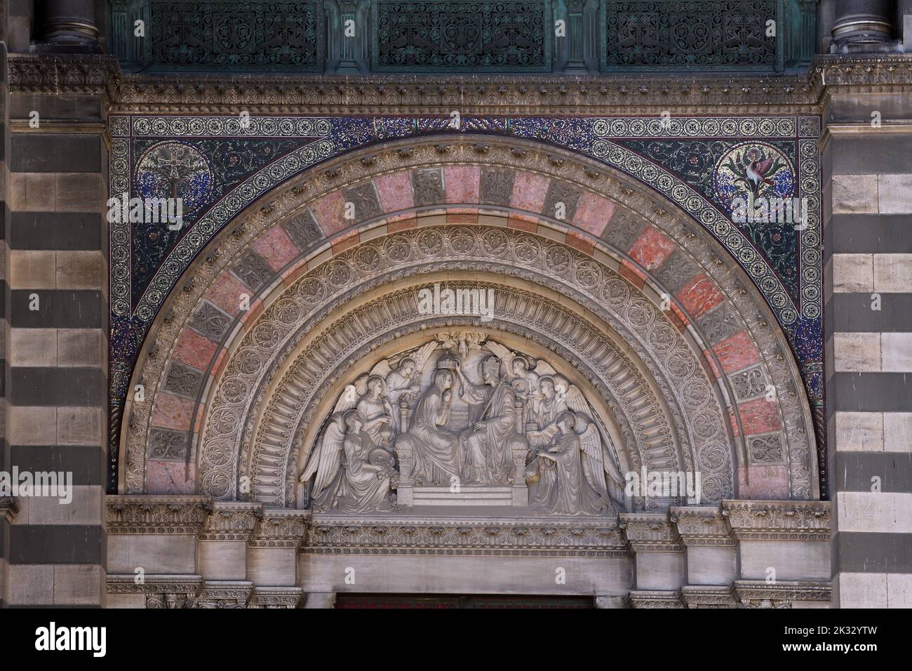 Cathedrale Sainte-Marie-Majeure (Cathedral of Saint Mary Major) Tympanum Above Entrance of the Virgin Mary's Coronation by Eugene Guillaume Marseille Stock Photo