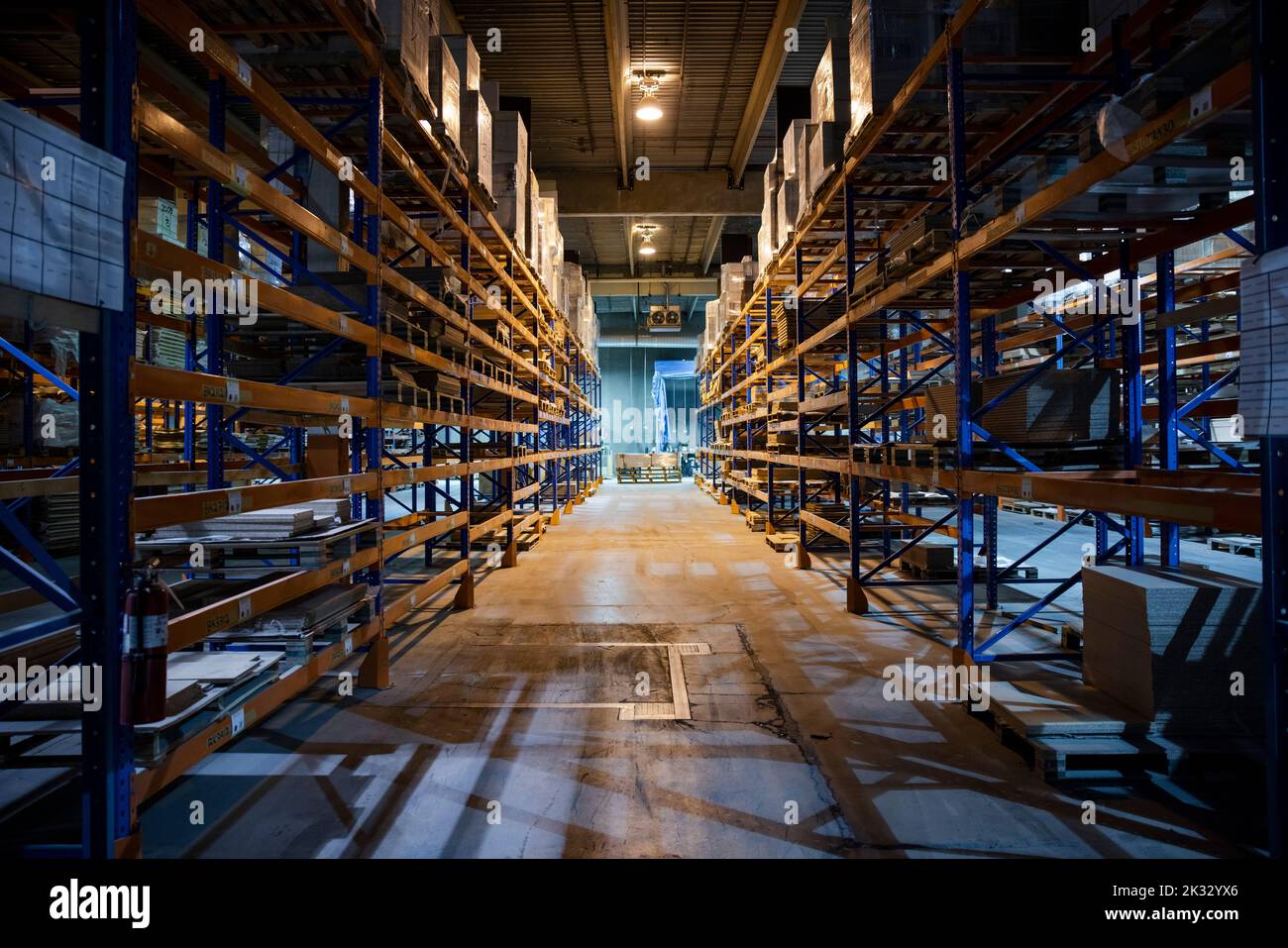 Distribution warehouse with high shelves Stock Photo