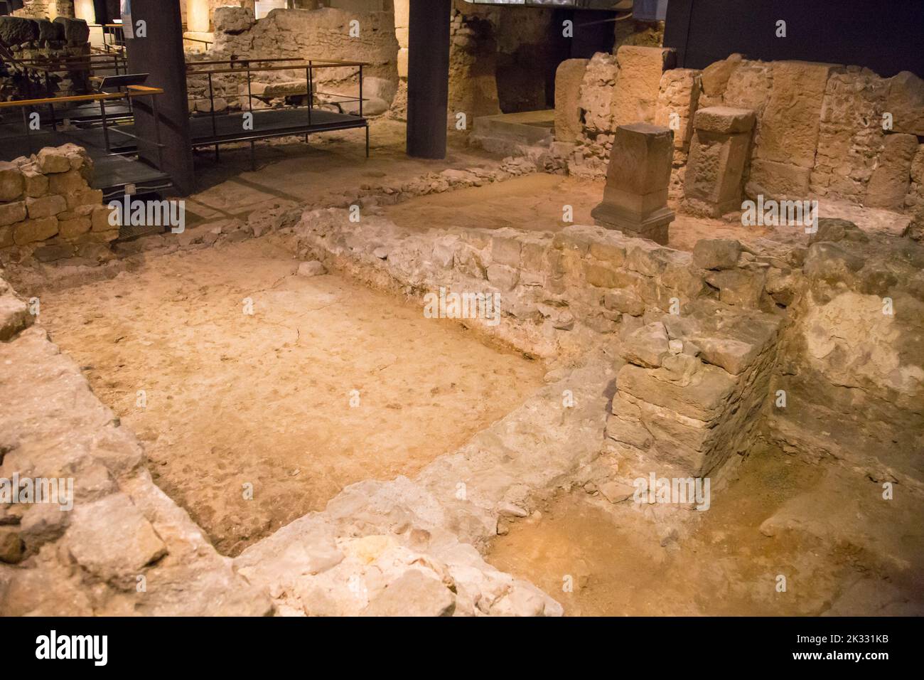 Remains of Roman streets under Placa del Rei Medieval building with museum, Barcelona, Spain Stock Photo