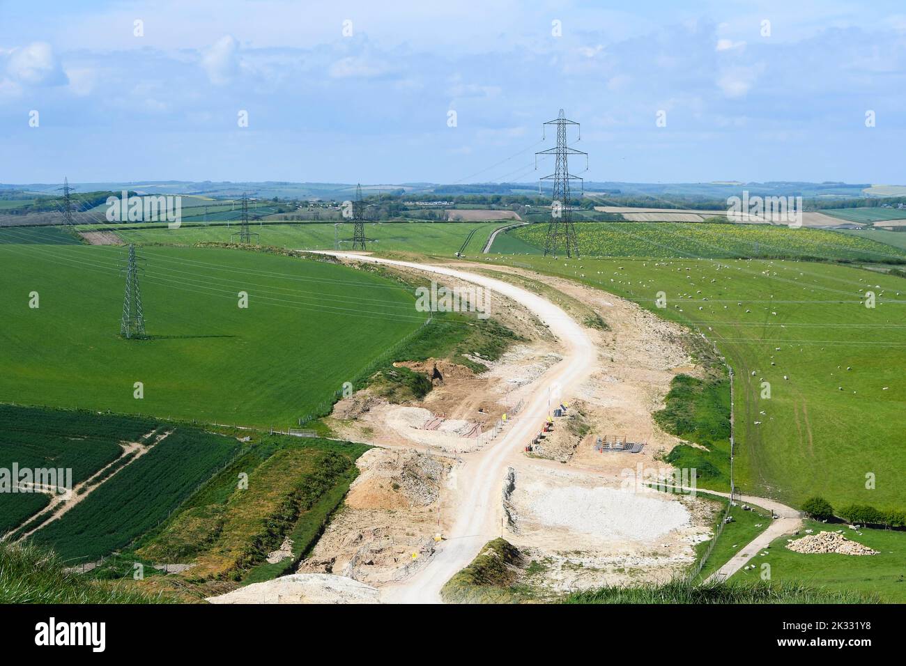 View of work to bury power lines and remove National Grid pylons at Winterbourne Abbas in Dorset to enhance the Area of Outstanding Natural Beauty. Stock Photo