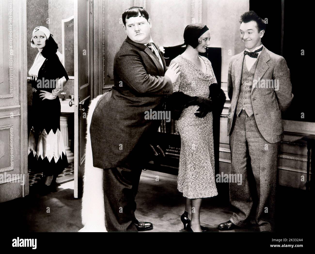 Stan Laurel and Oliver Hardy in the  film scene 'Chickens come home' 1931 Stock Photo