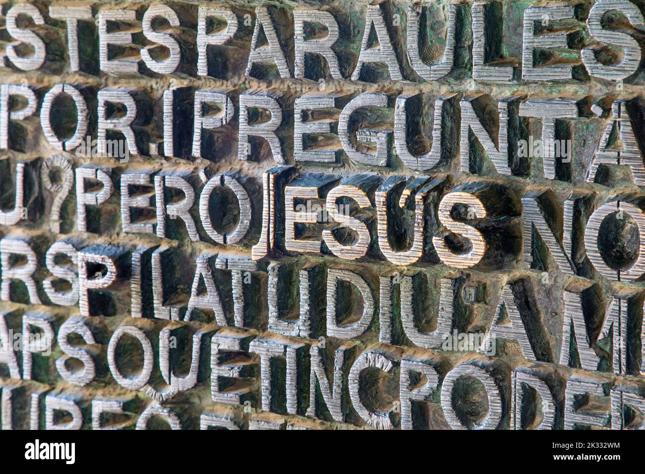 The word Jesus on the intricately carved door of the Sagrada Família, Barcelona, Spain Stock Photo