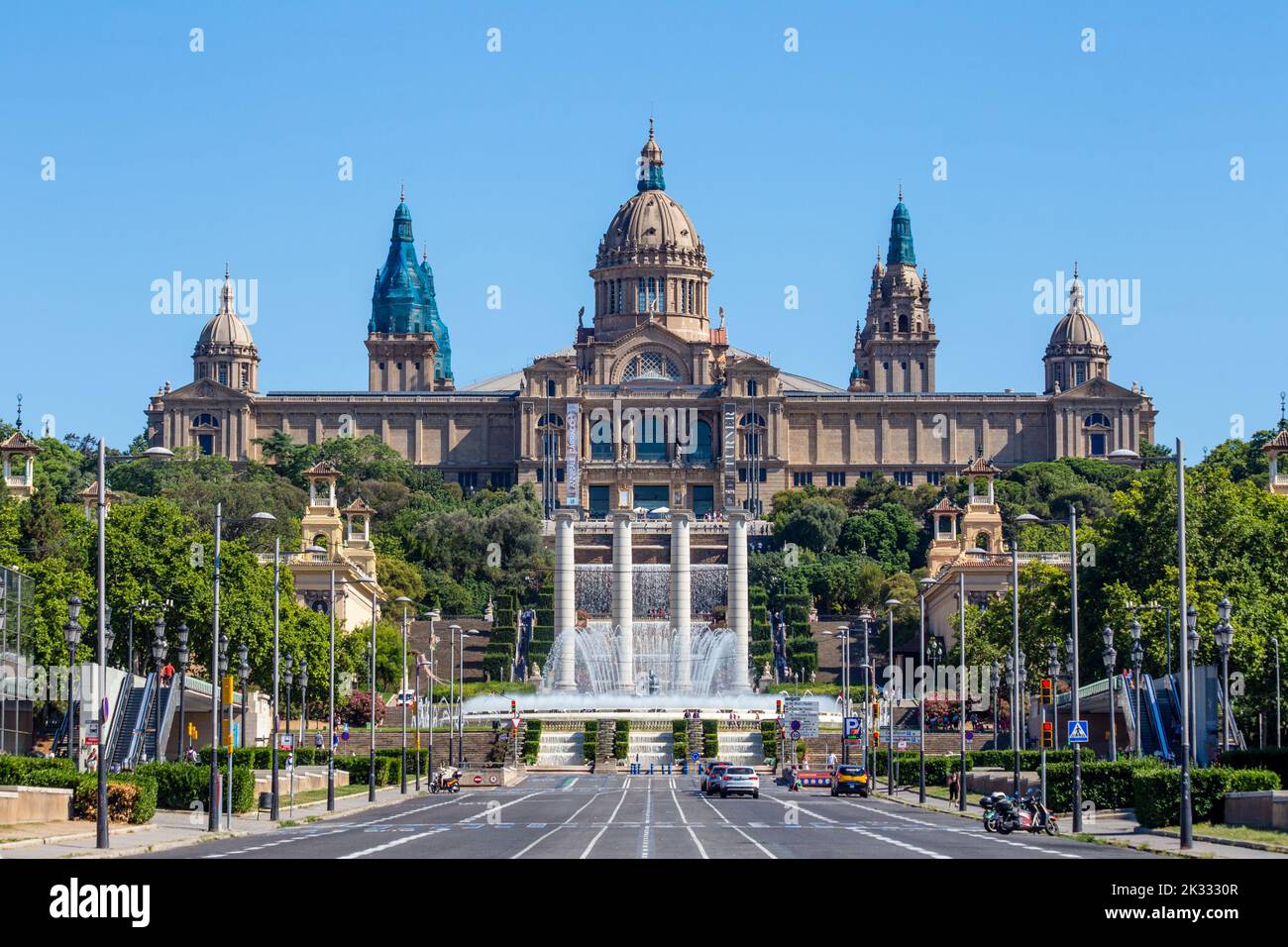 View to Montjuïc National Palace over the Magic Fountain of Montjuïc from Placa d'Espanya, Barcelona, Spain Stock Photo