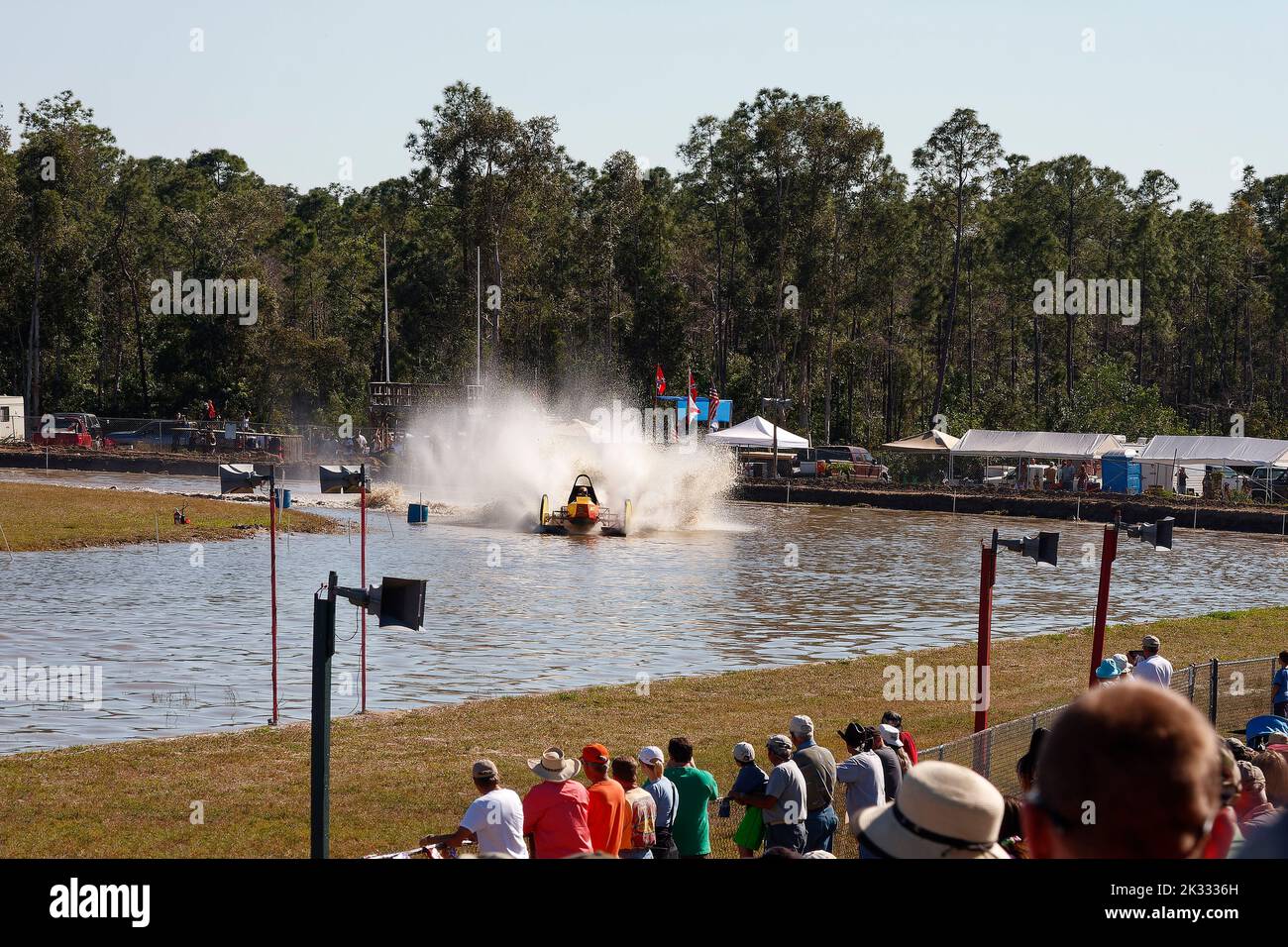 swamp buggy racing, large water spray, action, spectators, contest, motion, sport, scene, Florida Sports Park, Naples, FL Stock Photo