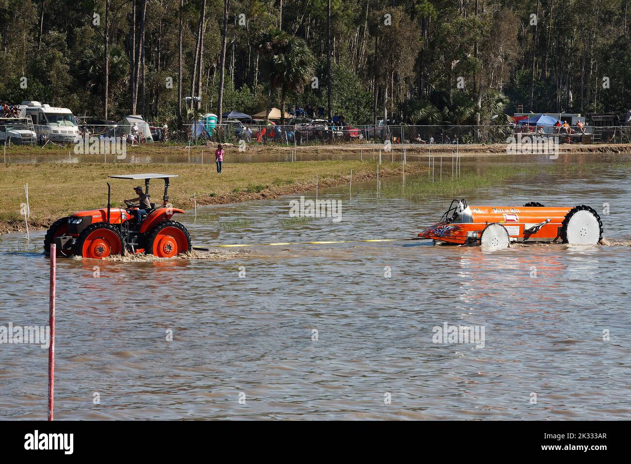 swamp buggy being towed, broken down during race, help, assistance, moving through water, jeep style, vehicle sport, Florida Sports Park, Naples, FL Stock Photo